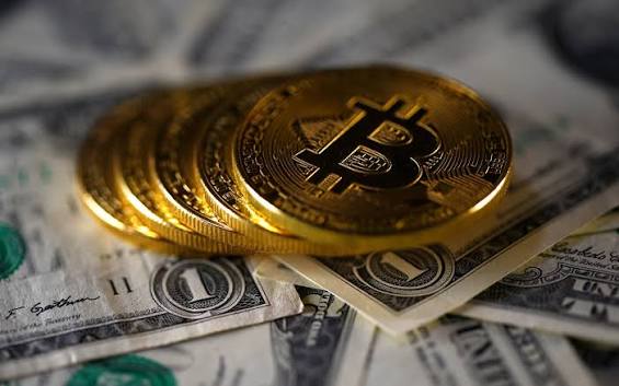 Bitcoin coin over US dollar currency